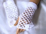 white crochet net fingerless gloves with crochet flowers are great to spruce up any bridal look on a cold day