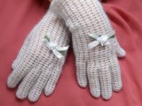 classic white crochet gloves with little bows are amazing for a winter bride, especially if you are rocking a vintage look