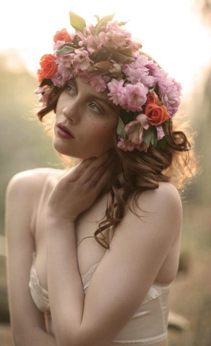 a bright floral crown with pink and orange blooms and foliage is a lovely idea for a delicate spring or summer bridal look