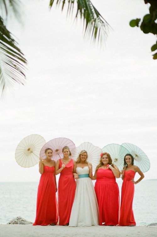 mismatching bright coral maxi dresses will show off the style of each gal and add color to the wedding