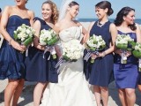 mismatching blue and navy short bridesmaid dresses are nice for any coastal or nautical wedding