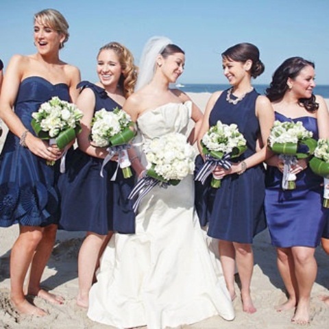 mismatching blue and navy short bridesmaid dresses are nice for any coastal or nautical wedding