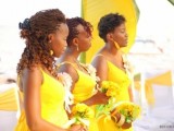 bright yellow A-line bridesmaid dresses with V-necklines and straps and matching earrings to add bright colors to the wedding