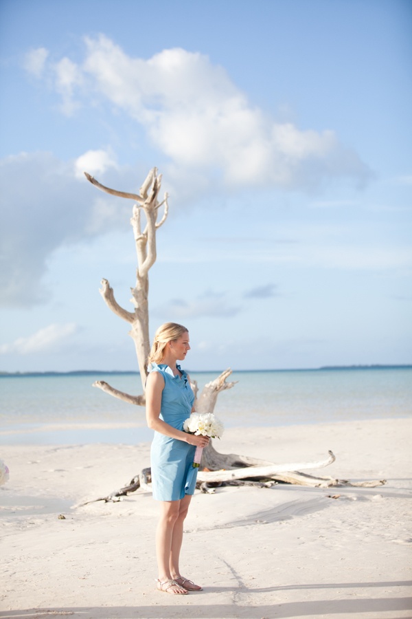 A short beach bridesmaid dress with ruffled straps for a romantic pastel beach wedding
