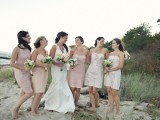 mismatching short blush and light pink bridesmaid dresses can be a nice fit for a romantic beach wedding