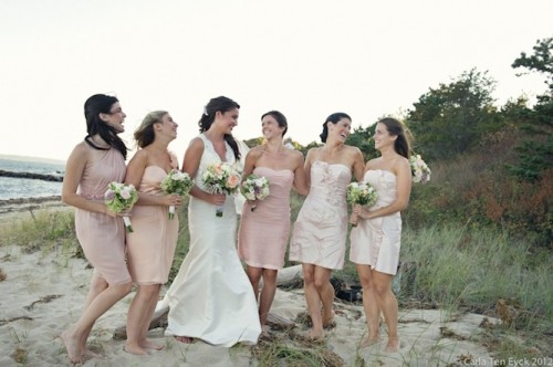 mismatching short blush and light pink bridesmaid dresses can be a nice fit for a romantic beach wedding
