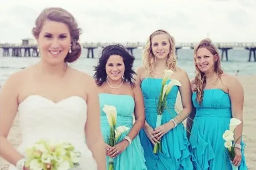 mismatching strapless blue bridesmaid dresses with ruffle skirts are lovely and bright