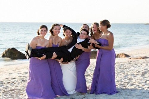 strapless purple bridesmaid dresses with draped bodices are bold and chic, perfect for a refined wedding