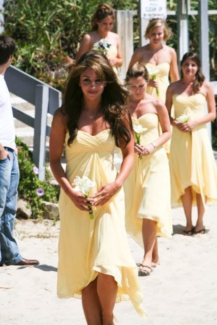strapless yellow bridesmaid dresses with draped bodices and asymmetric skirts are very lovely
