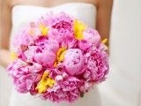 a pink peony wedding bouquet with some yellow touches is a lovely and cool idea for a spring or summer wedding