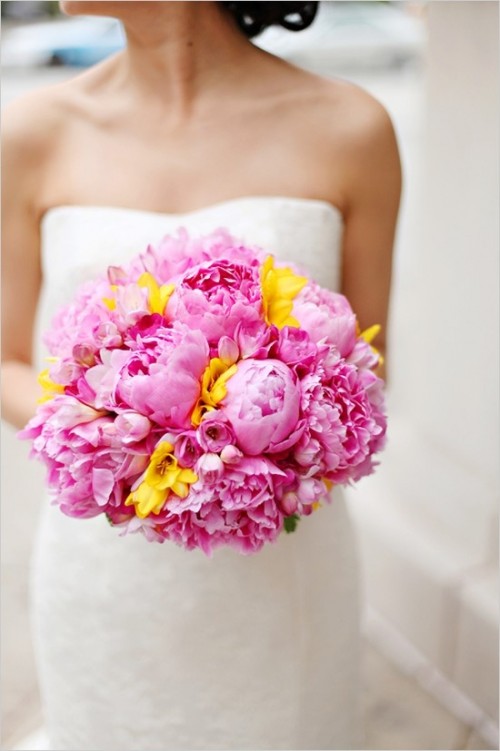 a pink peony wedding bouquet with some yellow touches is a lovely and cool idea for a spring or summer wedding