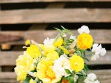 a bold summer wedding bouquet of yellow and white blooms and some greenery is a chic and elegant idea for a spring or summer wedding