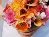 a bold wedding bouquet with orange and pink blooms and light pink ones for a contrast is a lovely idea of a bold touch at the wedding