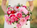 a pretty wedding bouquet of light and hot pink blooms and greenery plus white flowers is a pretty idea for a spring or summer wedding in pink