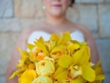 a bold yellow wedding bouquet of roses and orchids is a lovely idea for a bold spring, summer or fall wedding, with this color in the palette