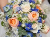a lovely and bright summer wedding bouquet of white, peachy pink and blue blooms and greenery is a cool idea for summer