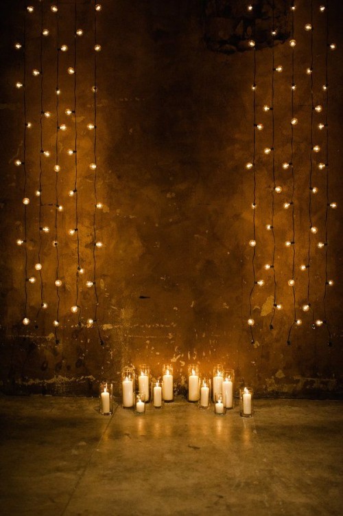 lights hanging down and some candles on the floor are a great idea not only for a fall but for many other weddings, too