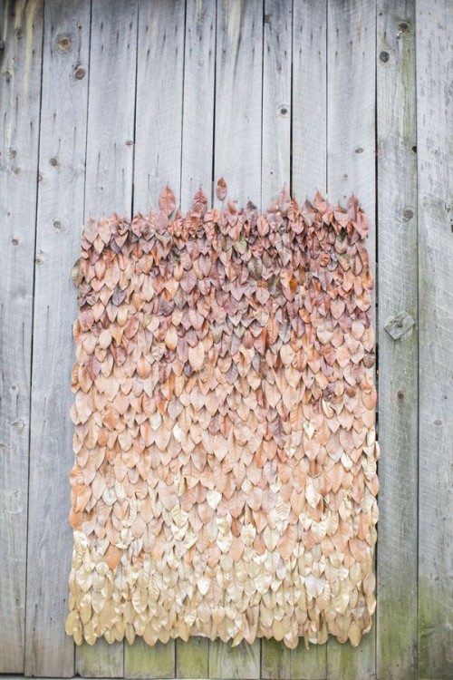 a bold ombre fall leaf wedding backdrop is a beautiful way to embrace the season and can be DIYed if you are ready to spray paint a lot of leaves