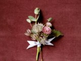 a delicate fall wedding boutonniere with leaves and dried pink blooms will fit many weddings with a slight decadent feel