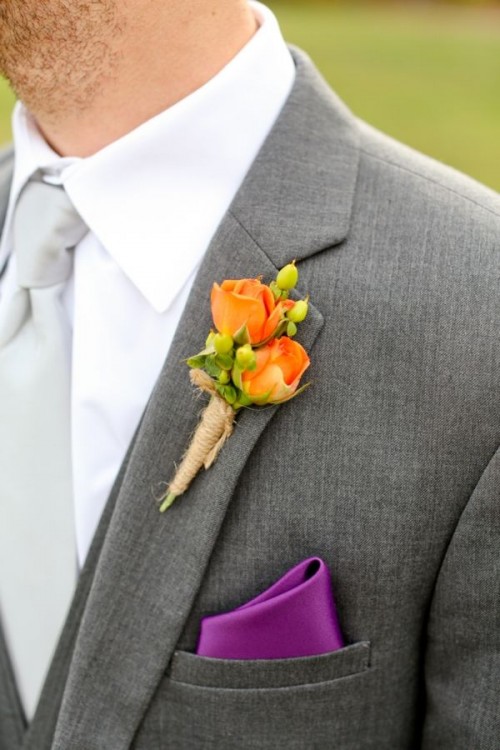 a small and bright wedding boutonniere with orange blooms and berries and twine wrap is a stylish and pretty idea