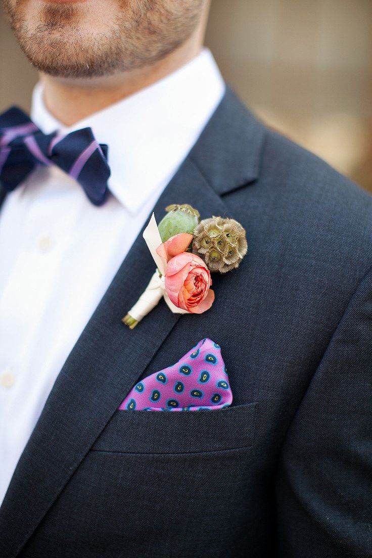 a quirky wedding boutonniere with a pink bloom, greenery and a sphere is a refined idea for a stylish fall groom