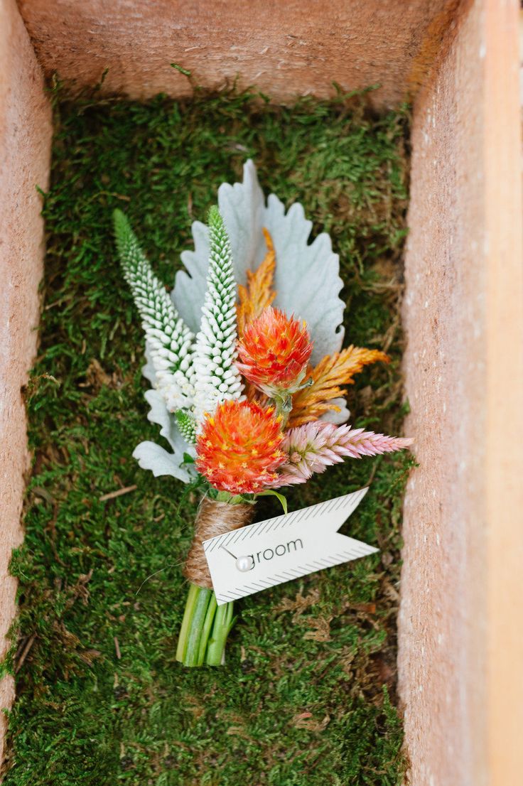 a bright fall wedding boutonniere with orange blooms, white and pink branches and a pale leaf is a catchy and cool idea