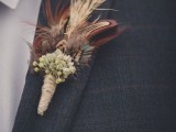 a boho fall wedding boutonniere with grasses, feathers, some berries and twine will also fit a rustic wedding