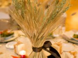 a wheat fall wedding centerpiece is a cool solution for a fall wedding that won’t wither