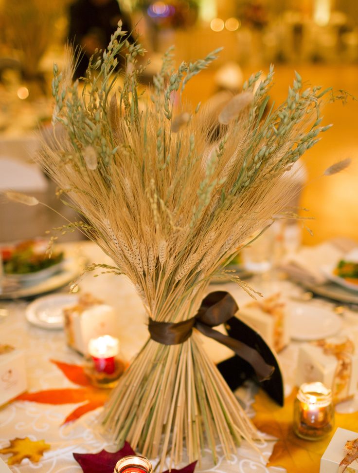 a wheat fall wedding centerpiece is a cool solution for a fall wedding that won't wither