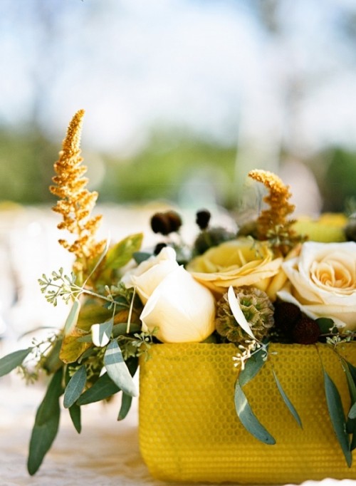 a gold box with neutral blooms, greenery and some dried touches is a chic decadent fall wedding centerpiece