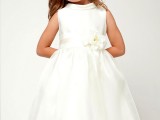 a white sleeveless high neckline flower girl dress with a white sash and a flower on it is a stylish and pretty idea