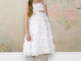 a white floral A-line flower girl dress with a pink sash, tights, embellished shoes and a pretty headpiece for a little princess