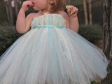 a blue and white tulle strapless flower girl dress for a very little bridesmaid