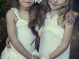 white vintage-inspired flower girl dresses with ruffles and embellishments are lovely and chic