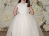 a sleeveless flower girl ballgown with a full skirt and an embellished and embroidered bodice for a chic look