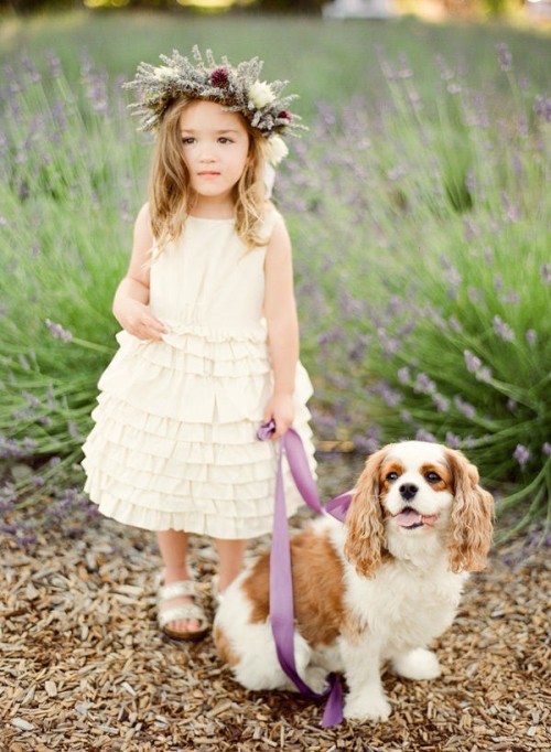 a neutral sleeveless flower girl dress with a sleek bodice and a ruffle skirt is a stylish idea for a spring or summer flower girl