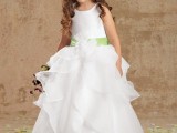 a white sleeveless flower girl ballgown with a layered ruffle skirt and a sleek bodice, a green sash for a beautiful classic look
