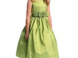 a green sleeveless A-line midi flower girl dress with a fabric sash is a bright and classic formal idea to rock