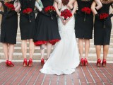 black and red sheath bridesmaid dresses and an A-line one, red shoes and blooms for a stylish Halloween wedding