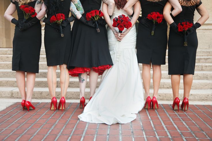 black and red sheath bridesmaid dresses and an A line one, red shoes and blooms for a stylish Halloween wedding