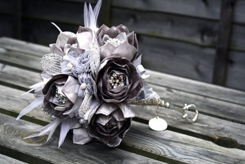 a grey and lavender wedding bouquet with rhinestones and beads is a unique idea that may match your color scheme or not