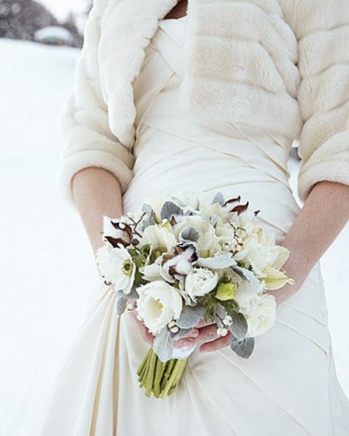 a white and pale winter wedding bouquet with blooms, cotton and foliage