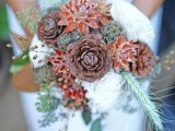 a dried winter wedding bouquet of pinecones, blooms, dried foliage and herbs will also do for a fall wedding