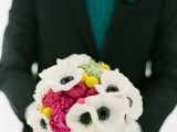 a bold winter wedding bouquet with white and pink blooms plus billy balls will add a colorful accent