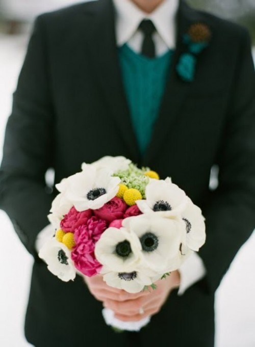 a bold winter wedding bouquet with white and pink blooms plus billy balls will add a colorful accent