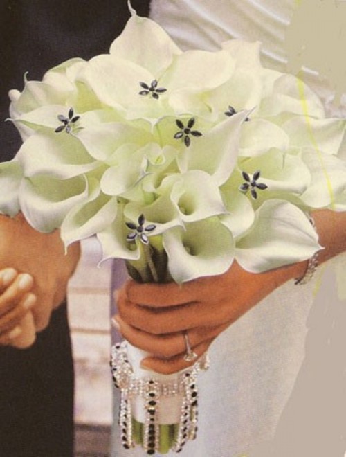 a white calla wedding bouquet with beaded flowers is classics and chic, it will give a refined touch to your look