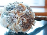 fabric flowers, shiny and bold rhinestone brooches make up a chic and bright winter wedding bouquet