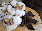 a cozy winter wedding bouquet of cotton with a large brown bow is a very cute fluffy option