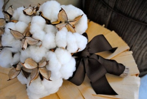 a cozy winter wedding bouquet of cotton with a large brown bow is a very cute fluffy option