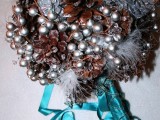 a unique silver berry and pinecone wedding bouquet is very durable and very cool for winter